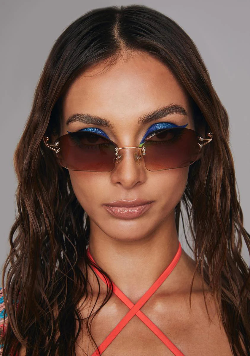 Cosmic Amber Gold Rimless Sunglasses